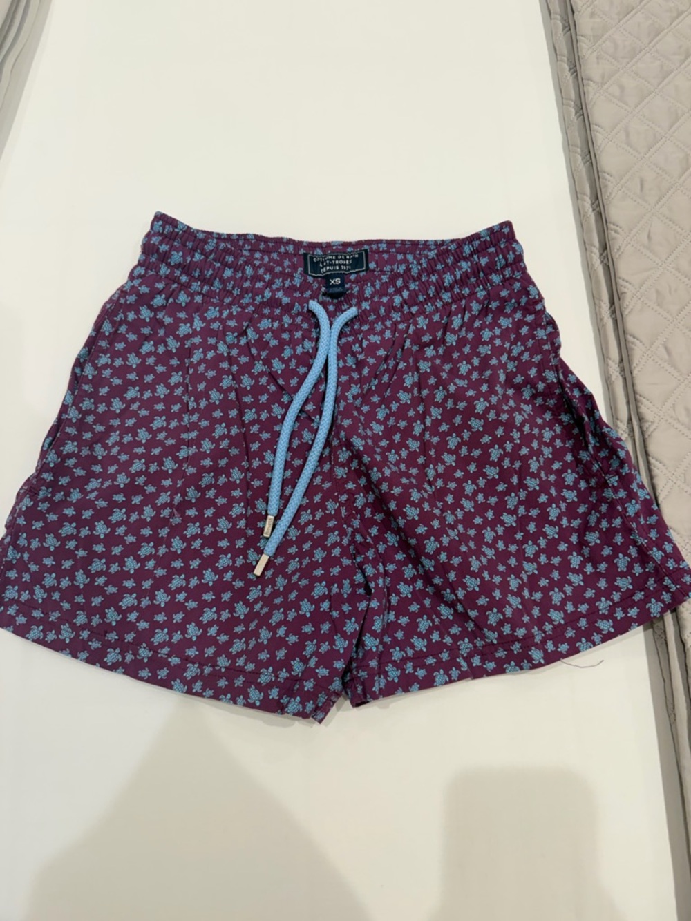 Vilebrequin Burgundy Swim Shorts with Light Blue Floral Print.
